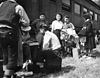 Japanese evacuees on August 30, 1942, arrive by train, wait for the bus ride to Camp Amache, Granada Relocation Center, southeastern Colorado.
