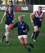 A Melbourne University player takes possession of the ball in the 2007 VWFL Grand Final won by the Darebin Falcons.