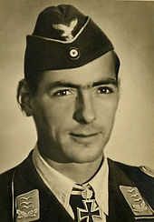 Head-and-shoulders portrait of a uniformed German air force pilot in his 30s wearing an Knight's Cross