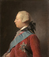 Quarter-length portrait in oils of a clean-shaven young man in profile wearing a red suit, the Garter star, a blue sash, and a powdered wig. He has a receding chin and his forehead slopes away from the bridge of his nose making his head look round in shape.