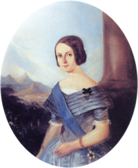 Half-length painted portrait of a smiling young woman in early Victorian blue formal gown wearing a blue sash of office over one shoulder