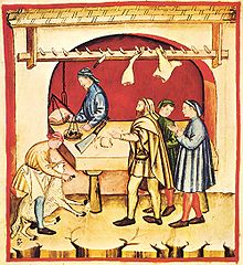 This picture is showing a 14th century butcher doing his trade in a traditional manner.