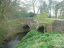 Stone two arch bridge over river