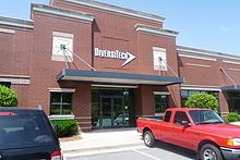 Exterior of red brick office with silver DiversiTech logo