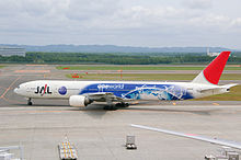 A Japan Airlines Boeing 777-300 painted in special oneworld livery, taxiing at New Chitose Airport