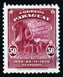 A postage stamp of Paraguay showing a 19th-century man sitting in a chair with books lining the wall behind him. The cost is 50 centavos.