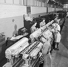 An image of female workers on an engine assembly line