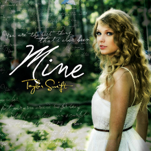 A blonde woman is standing aside in a white dress, looking forward. Next to her, the word "Mine" is written in white. Under the word "Mine", the words "Taylor Swift" are printed in yellow.
