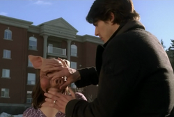 Bobby removing Sandra's pig mask
