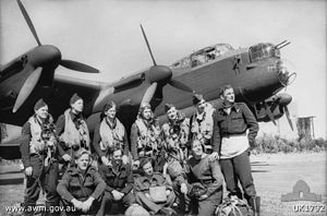 Aircrew and ground staff from No. 467 Squadron RAAF with one of the Squadron's Lancaster bombers in August 1944