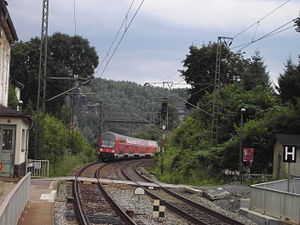 Double-decker train approaching the spa town of Rathen
