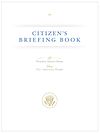 A white rectangular book cover, with the title "CITIZEN'S BRIEFING BOOK" in a blue serif font near the top; "To President Barack Obama / From The American People" near the middle; and the presidential seal in gold near the bottom.