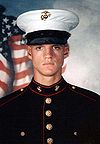 Head and shoulders of serious young man in circa 2000 U.S. Marine dress uniform.