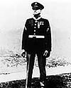Full length portrait of standing man in circa 1930 U.S. Marine dress uniform.