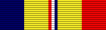 A multicolored military ribbon. From left to right the color pattern is; very thick blue stripe, very thick yellow stripe, thin red stripe, thicn white stripe, thin blue stripe, very thick yellow stripe, very thick red stripe
