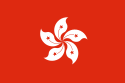 A flag with a white 5-petalled flower design on solid red background