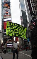 Woroniecki carries sign in Times Square that reads "Discover forgiveness for all your sin and eternal life in the Living Jesus".