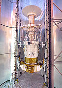 Magellan being fixed into position inside the Space Shuttle Atlantis cargo bay prior to launch
