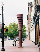 Statue of a number of stacked cylinders in the shape of a tornado, a memorial to a tornado that passed through Main Street in Louisville in 1890