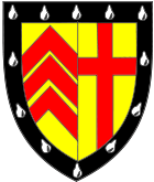 Clare College heraldic shield: The Clare coat of arms is divided into two equal parts. On the left hand side there are the three chevrons of the de Clare family. On the other side of the shield is the Cross, the symbol of the Christian roots of the College.