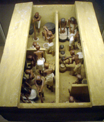 A funerary model of a bakery and brewery, dating the 11th dynasty, circa 2009-1998 B.C. Painted and gessoed wood, originally from Thebes.