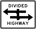 A divided highway sign. Two parallel arrows, pointing in opposite directions are crossed by a vertical line.