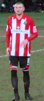 Mark Yeates SUFC Jon Candy Owned Image.png