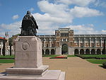 Rice University - Rice statue with Lovett Hall.JPG