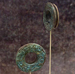 Copper ear spools from the Spiro Site