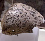 An engraved shell cup from the Spiro Site, with a raptor head motif