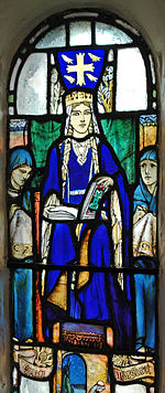 A blue-robed woman wearing a crown