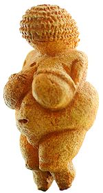 A carved stone miniature figurine depicted an obese female.