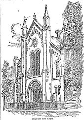 A drawing of the facade of a two or three story building obliquely faces the reader. The facade has three bays, and the roof is steeply sloped. The central bay has a large arched recessed entrance-way, with two tall narrow arched windows on top of it, and a rose window on top of them. Along the arch of the entrance-way are the words "Congregation Beth Elohim". The central bay is separated from the side bays by tall narrow rectangular towers, whose peaks match the height of the central peak of the roof. The side bays have one arched window over two smaller arched windows, and at the corners of the building are short narrow rectangular towers.