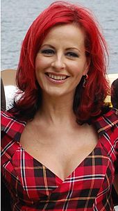 Upper body photograph of Carrie Grant.