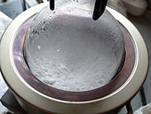 Water being extracted from the gypsum powder through heating.