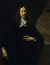 portrait of a man dressed all in black, looking left