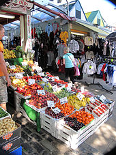 Stalls selling fruit and clothing