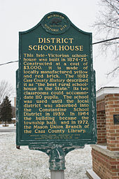 The Michigan Historical Marker that is placed on the grounds of the Mason School House.