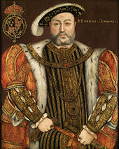 Painting of large bearded man with fur trimmed cloak, wearing a hat.