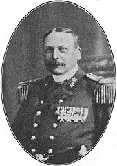 A mustachioed man in formal military dress, with shoulder boards and many medals