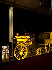 Small, bright yellow, steam locomotive