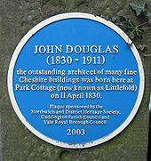 A circular blue plaque reading "JOHN DOUGLAS (1830–1911 the outstanding architect of many fine Cheshire buildings was born here at Park Cottage (now known as Littlefold) on 11 April 1830. Plaque sponsored by the Northwich and District Heritage Society, Cuddington Parish council and Vale Royal Borough Council 2003