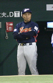 Sadaharu Oh standing wearing a Japan national baseball team uniform during the 2006 Wold Baseball Classic
