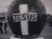 Woroniecki's CMU football helmet showing a cross with the word 'Jesus" written in it on the back of the helmet.