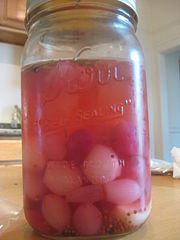 A jar of cocktail onions.