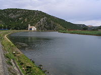 Croatian river with small mountain in background