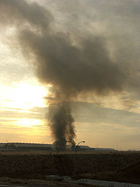 A distant shot of smoke coming from Madrid Barajas International Airport.