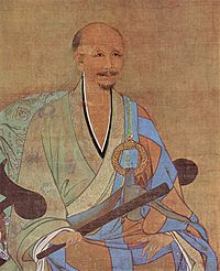 A portrait of an older, balding man in a half pale green and half sky blue robe. He is sitting on an armchair holding a thin wooden stick, possibally a folded up fan.