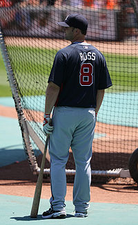 David Ross, stocky 32-year-old white man, is shown in the navy jersey and grey pants uniform of the Atlanta Braves, stands in the Braves' batting cages on June 14, 2009.