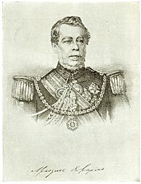 Lithograph depicting head and shoulders of a man with gray moustache wearing a military tunic with epaulettes and elaborate lanyards, several medals at his neck and breast, sash of office, and a prominent star on a heavy gold chain suspended from his shoulders